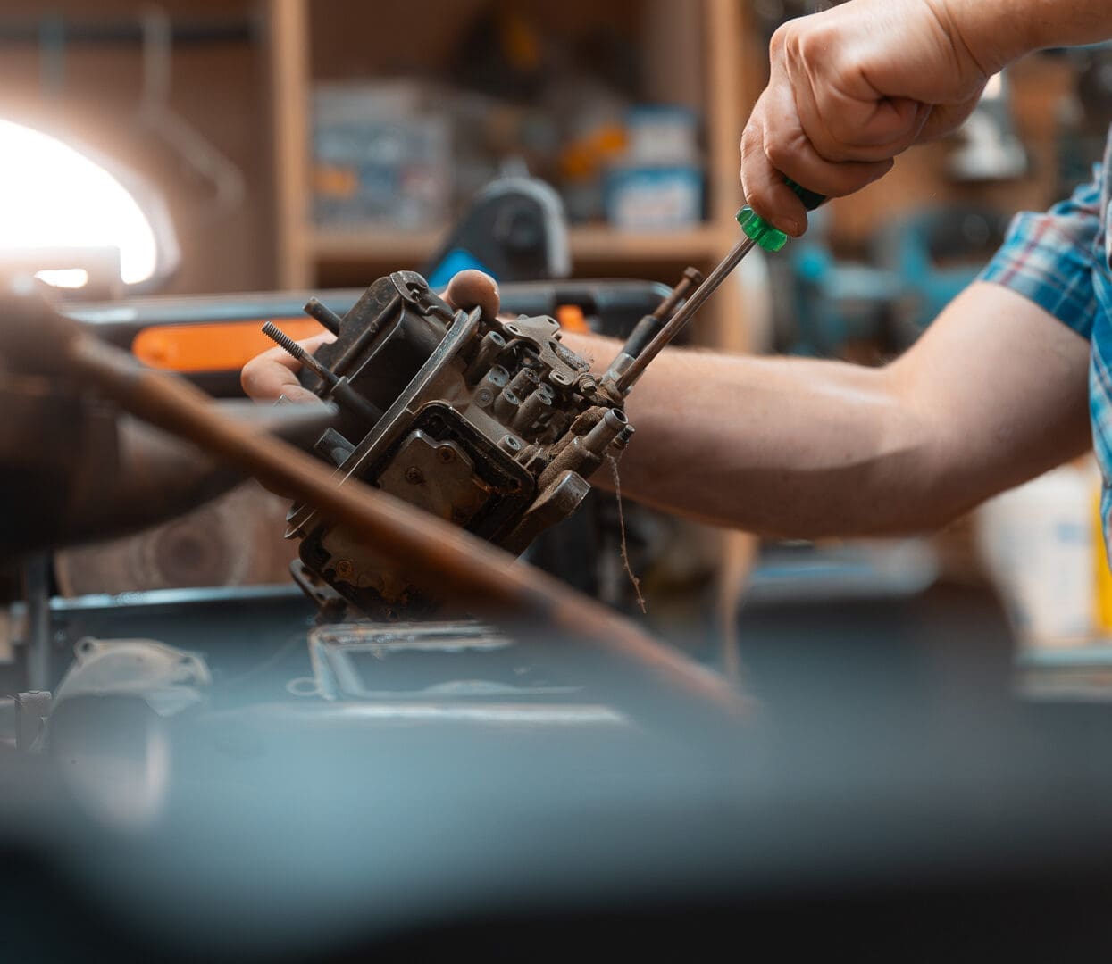 Mitch-38 mechanic working on a car engine